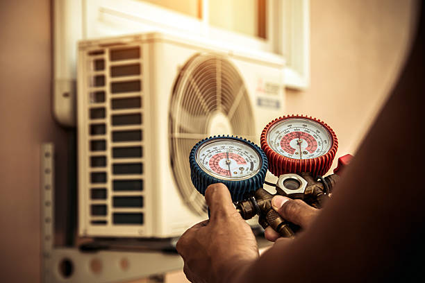 Professional Air Conditioning Service technician working in Sunset, UT
